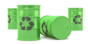 Green oil recycling barrels on a white background